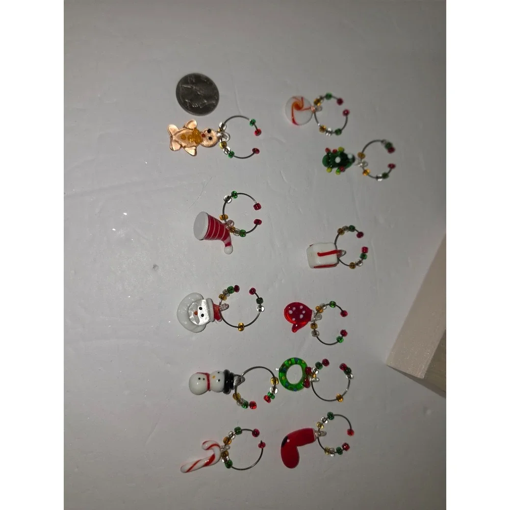 Pier 1 Imports reindeer wine charm‎ set featuring a decorative metal stand